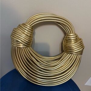 This golden knotted handbag!